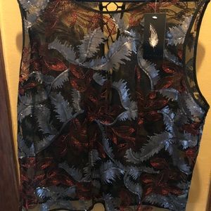 Sequined top with lace up the back.
